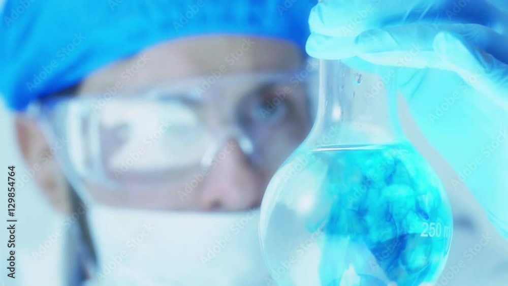 scientist or researcher working in laboratory, carrying out experiment scientist or researcher working in laboratory, carrying out experiment