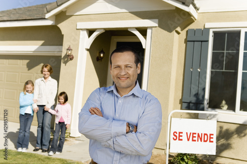 Wallpaper Mural Portrait of happy mature man with family standing in front of new house Torontodigital.ca