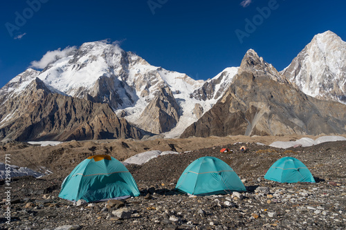Blue tents at Concordia camp in front of Broadpeak mountain, K2