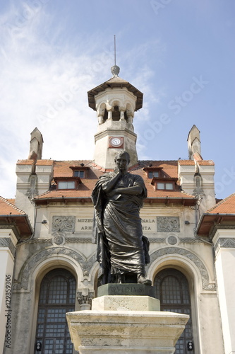Piata Ovidiu, the central square of the old quarter with a statue of the exiled poet, Ovid in front of the Archaeological and Historical Museum, Constanta, Romania photo