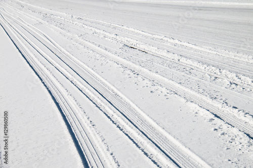 Car tire track in snow