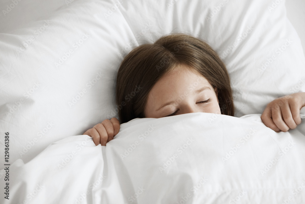 High angle view of little girl sleeping in bed High angle view of little girl sleeping in bed