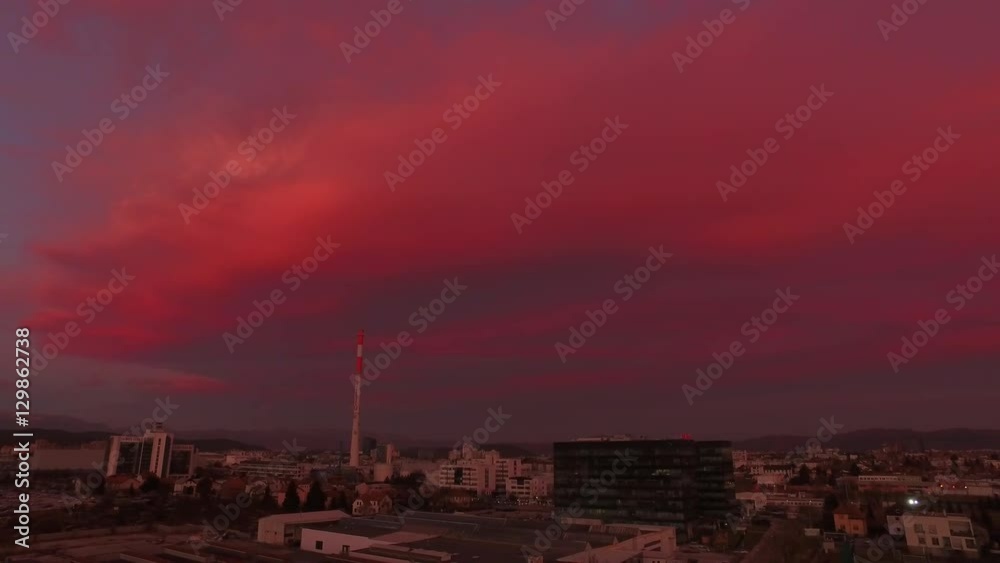 AERIAL: Industrial business zone in big city at red sunrise AERIAL: Industrial business zone in big city at red sunrise