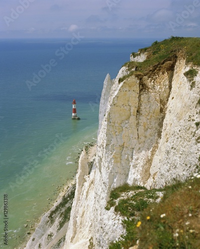 Lighthouse and chalk cliffs at Beachy Head, near Eastbourne, East Sussex, UK photo