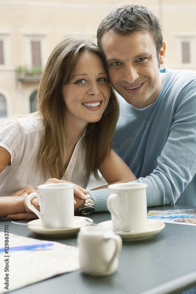Portrait of happy young couple at outdoor cafe in Rome Portrait of happy young couple at outdoor cafe in Rome