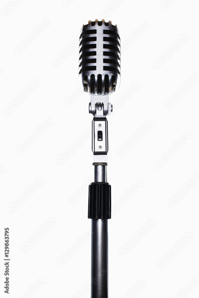 Fototapeta premium Old fashioned microphone isolated over white background
