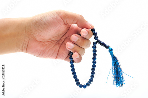 Male Hand with Rosary Isolated on White Background