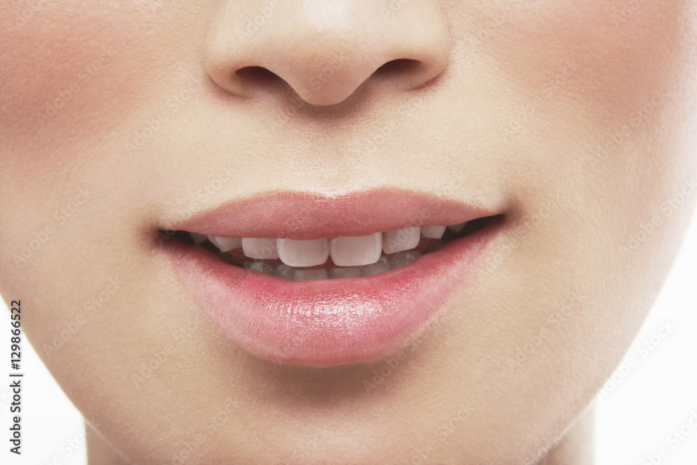 Naklejka premium Closeup of beautiful woman's lips on white background