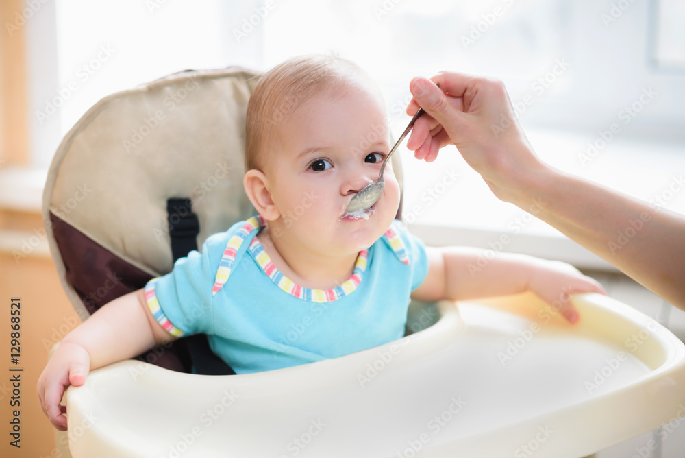 Mom feeds her nine months baby at home Mom feeds her nine months baby at home