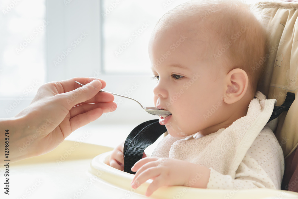 Mom feeds her nine months baby at home Mom feeds her nine months baby at home
