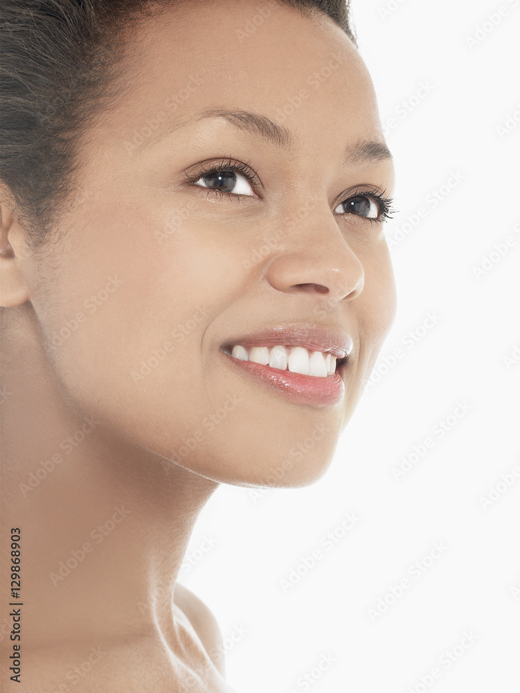 Obraz premium Headshot of an attractive young woman smiling against white background