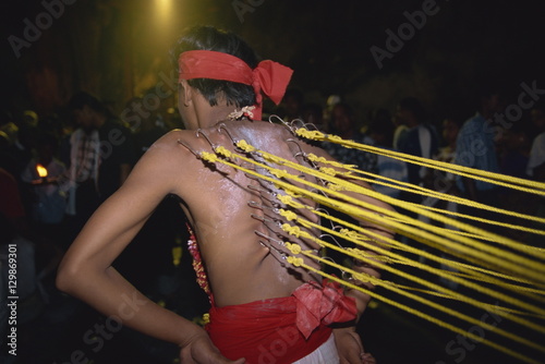 Man with hooks through the skin on his back at the annual Hindu festival of Thaipusam in the Batu Caves near Kuala Lumpur, Malaysia