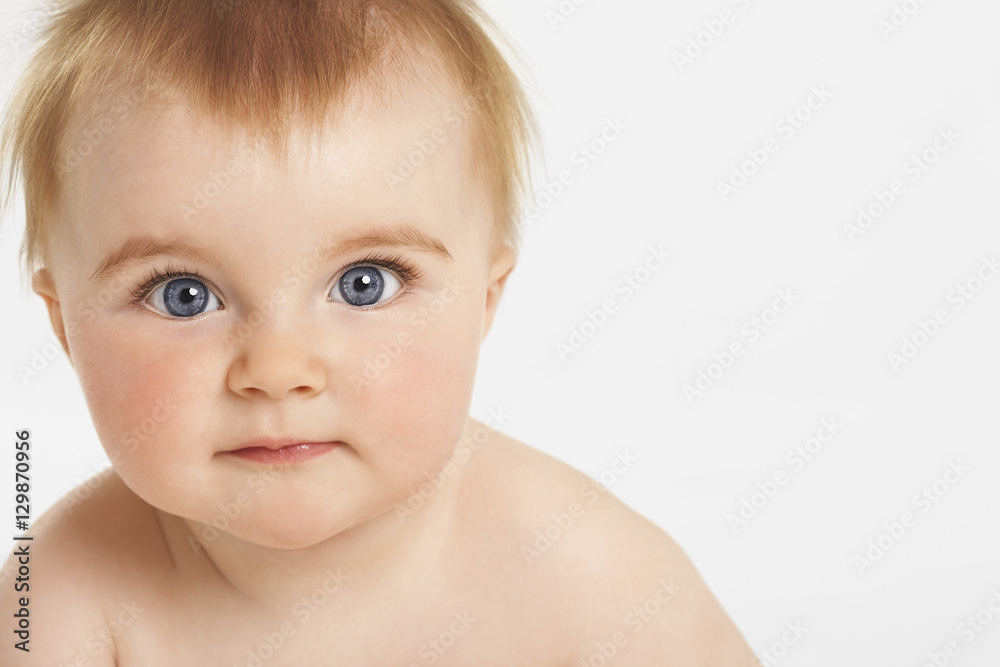Closeup portrait of cute baby with ginger hair isolated on white background Closeup portrait of cute baby with ginger hair isolated on white background