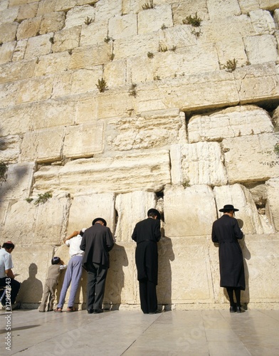 Jews praying at the Western Wall, Jerusalem, Israel photo