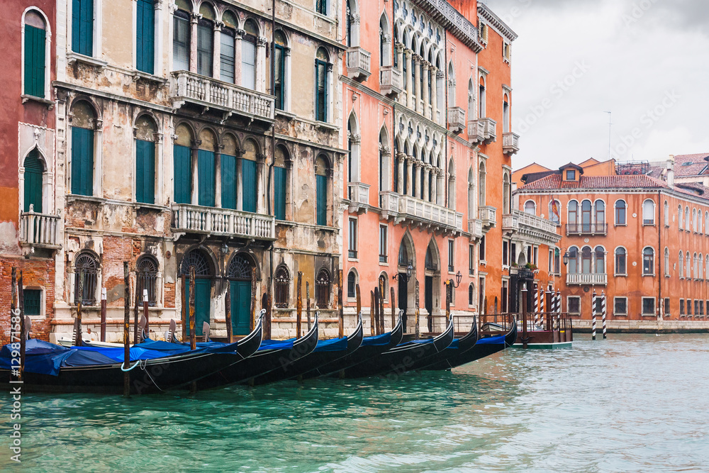 gondolas near houses in Venice in rain