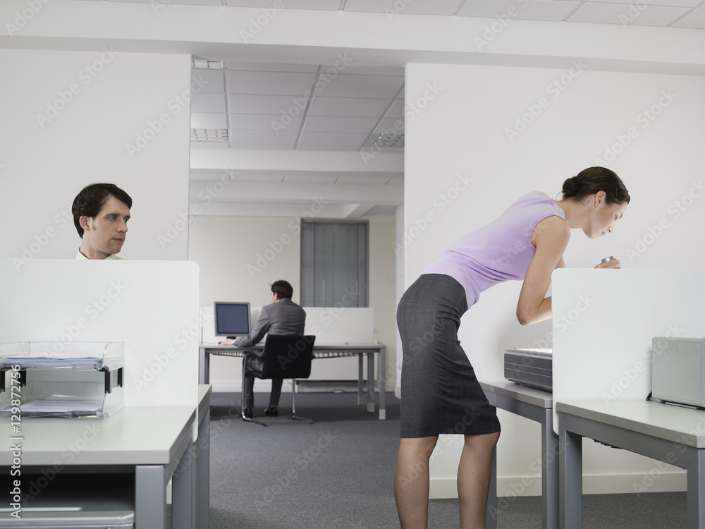 Pervert businessman watching female colleague in office Pervert businessman watching female colleague in office