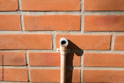 Water pipe at the brick wall
