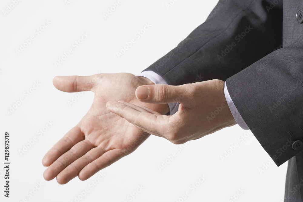 Obraz premium Closeup of business hands gesturing against white background
