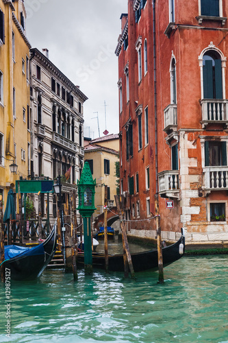 mooring of gondolas near houses in Venice in rain © vvoe