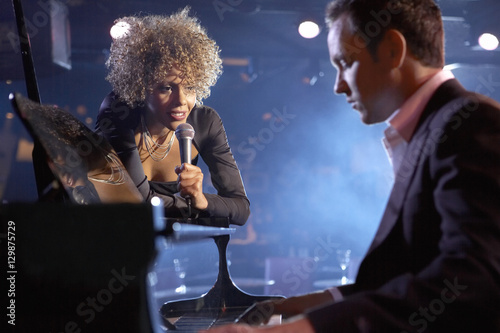Photography Female jazz singer and pianist on stage