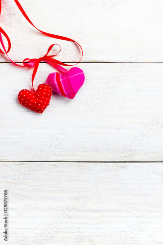 background for Valentine s Day greetings  sewn from various fabrics soft hearts on a wooden background