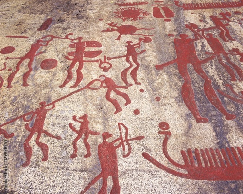 Ancient rock carvings from the Bronze Age, Fossum near Tanumshede, Gotaland, Sweden photo