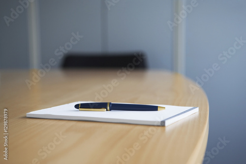 Closeup of diary with pen on wooden table