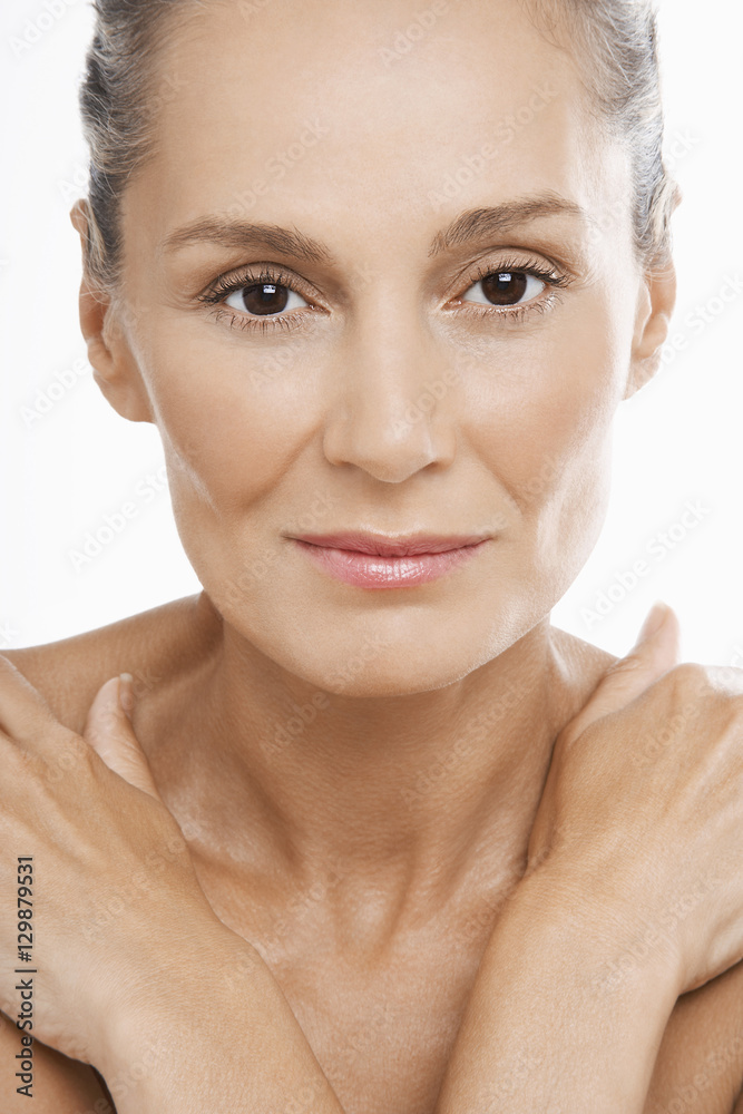 Closeup portrait of beautiful middle aged woman on white background Closeup portrait of beautiful middle aged woman on white background