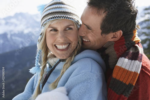 Closeup of a happy loving couple in warm clothing