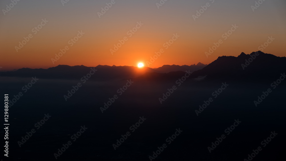 Sunset over the valley in the mountain Sunset over the valley in the mountain