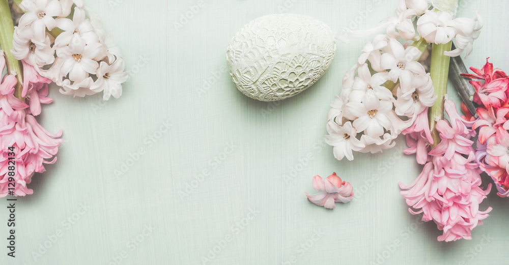 Easter banner with hyacinths and decor egg on light pastel wooden background, top view, place for text Easter banner with hyacinths and decor egg on light pastel wooden background, top view, place for text