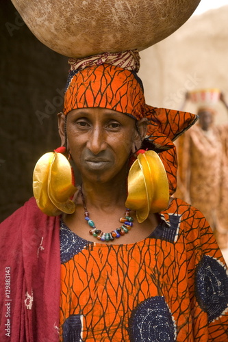 Portrait of a Fulani woman wearing traditional gold earrings, Mopti, Mali, West Africa photo