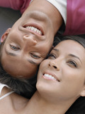 Closeup of a smiling young man and woman