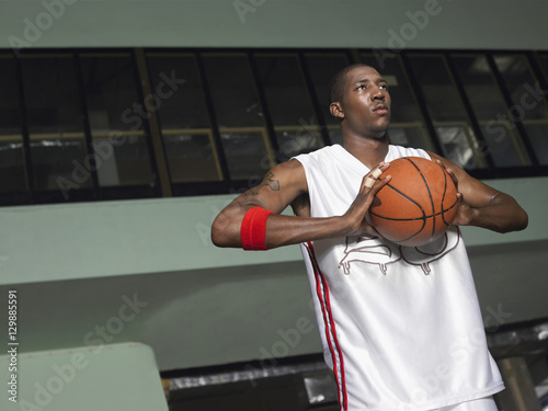 Low angle view of a basketball player preparing to pass ball
