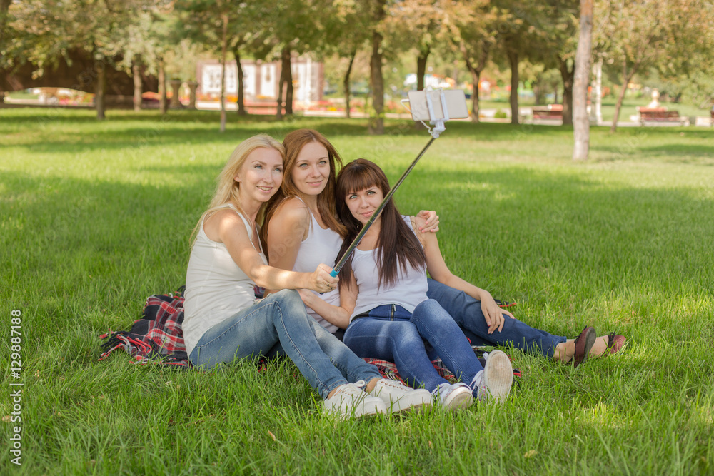 beautiful young girls in the park make selfi beautiful young girls in the park make selfi