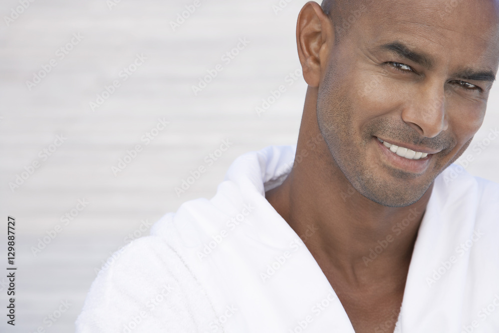 Portrait of handsome African American man in bathrobe smiling - obrazy, fototapety, plakaty 