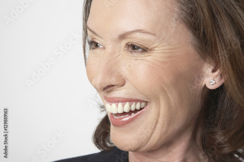 Closeup of a cheerful businesswoman isolated on white background