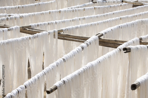 White silk drying in the sun on bamboo racks, Amarapura, near Mandalay