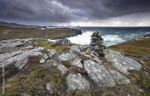 Dramatic rocky coastline above Gearrannan Blackhouse Village, near Carloway, Isle of Lewis, Outer Hebrides, Scotland  photo