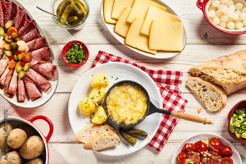 Canvas Print Delicious Swiss raclette cheese buffet