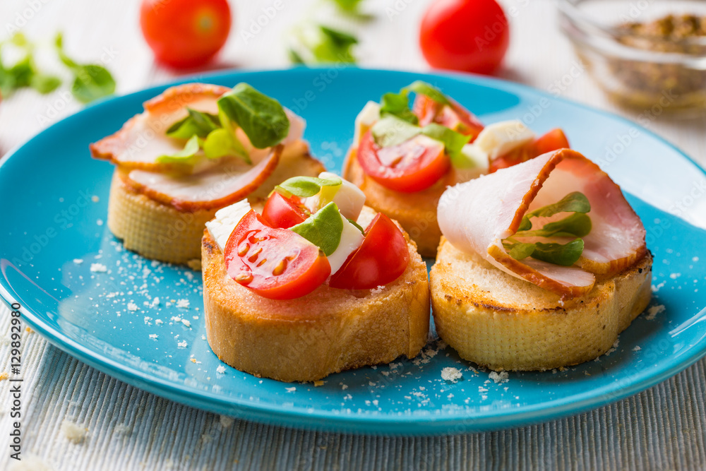 Bruschetta with tomato, cheese and bacon Bruschetta with tomato, cheese and bacon
