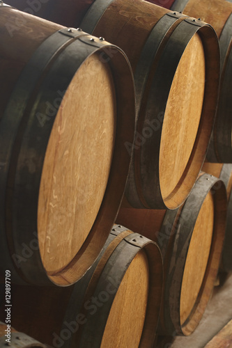 Closeup of wine casks in cellar