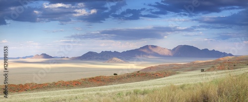 Panoramic view at dusk over the magnificent landscape of the Namib Rand game reserve, Namib Naukluft Park, Namibia photo