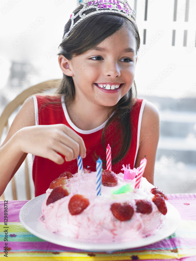 Closeup portrait of a smiling young girl with birthday cake Closeup portrait of a smiling young girl with birthday cake