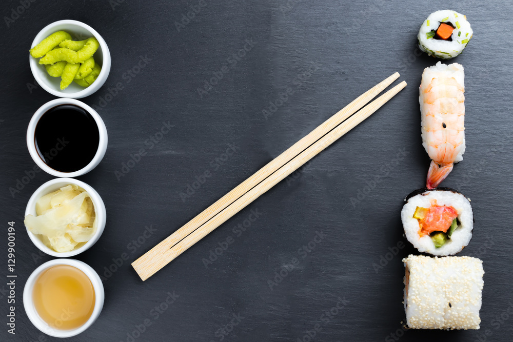 Typical asian cuisine set on black kitchen slate plate. Typical asian cuisine set on black kitchen slate plate.