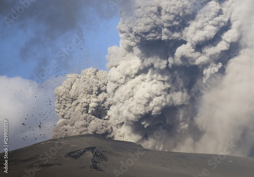 Eyjafjallajokull eruption showing billowing ash plume and rocks exploding into the sky of southern Iceland, Iceland