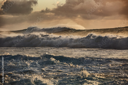 Sunset stormy ocean waves