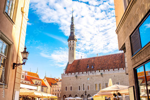 Street view with the town hall's tower on the central square in Tallinn, Estonia