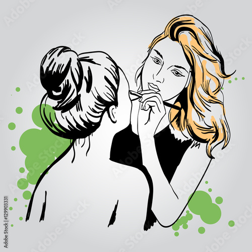 Woman makeup makeup artist paints on the face of his client. 