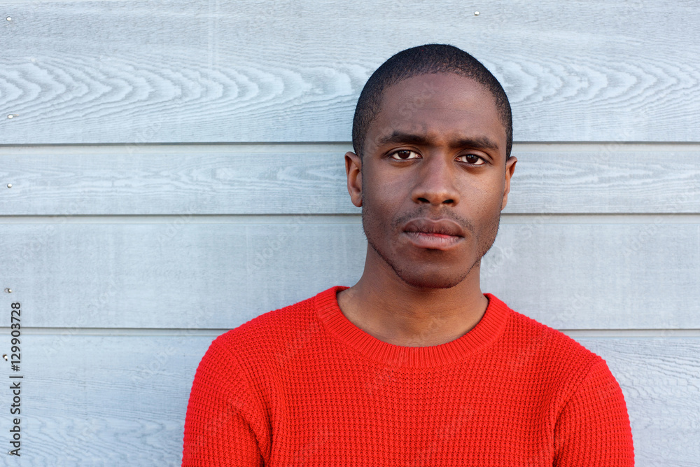 Obraz premium Close up serious black guy in red sweater